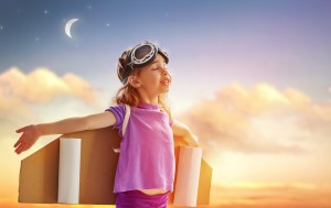 child is dressed in an astronaut costume